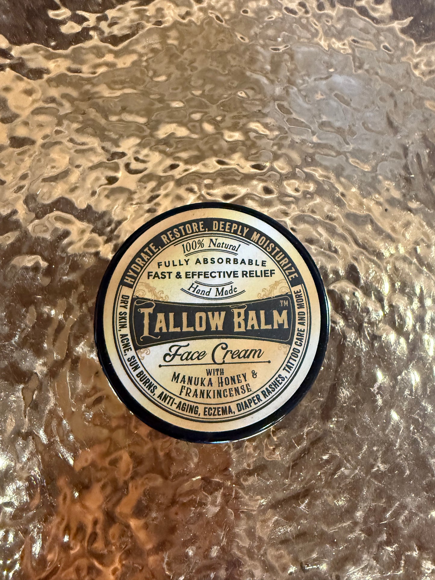 Face cream container with a label on a textured surface